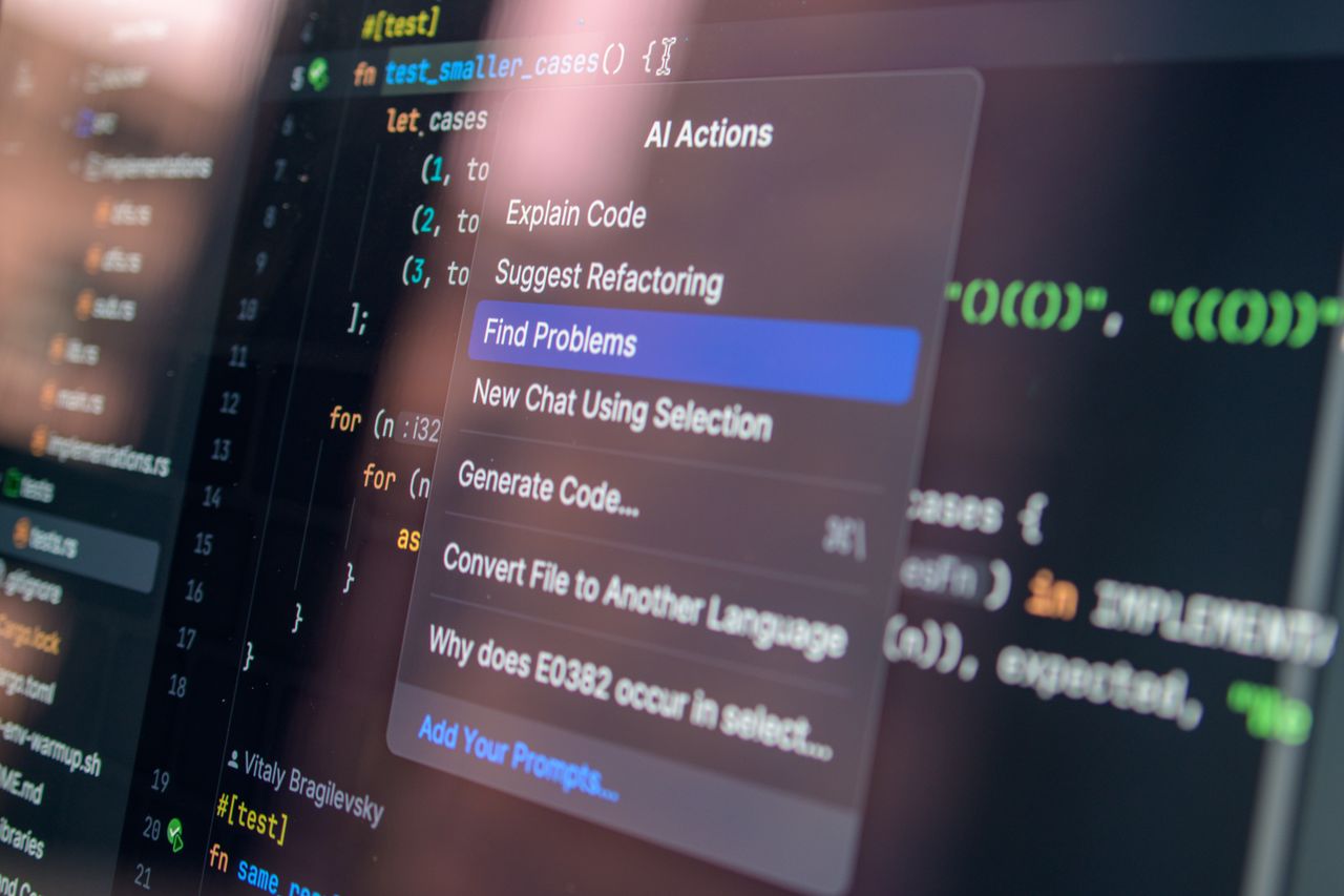menu-03 Close-up of AI-assisted coding with menu options for debugging and problem-solving.